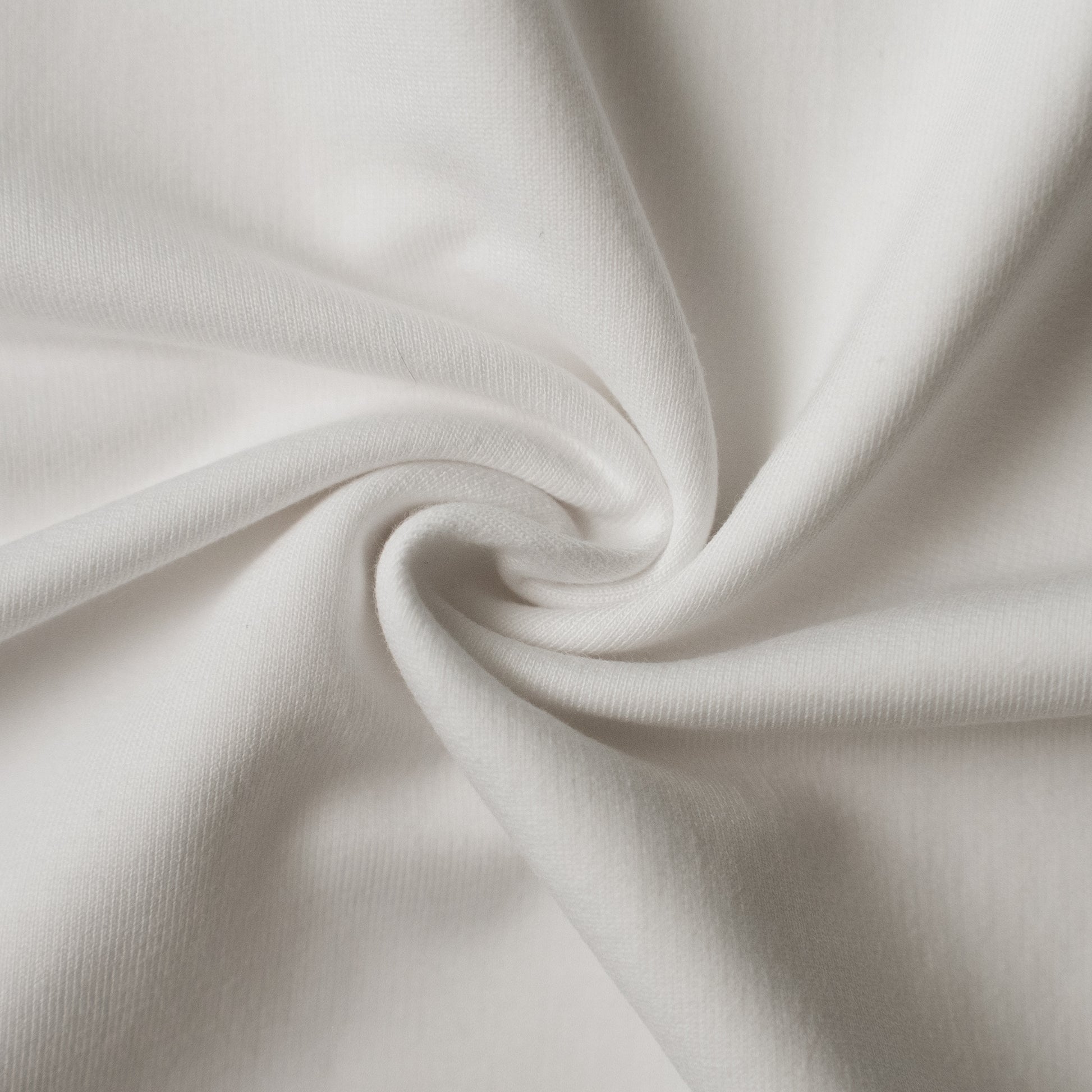 Close-up of white fabric with folds